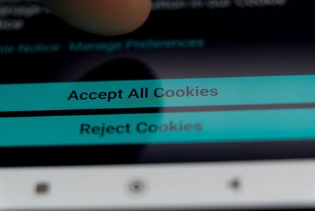 Close-up of a cookie consent banner with accept and reject options on a smartphone